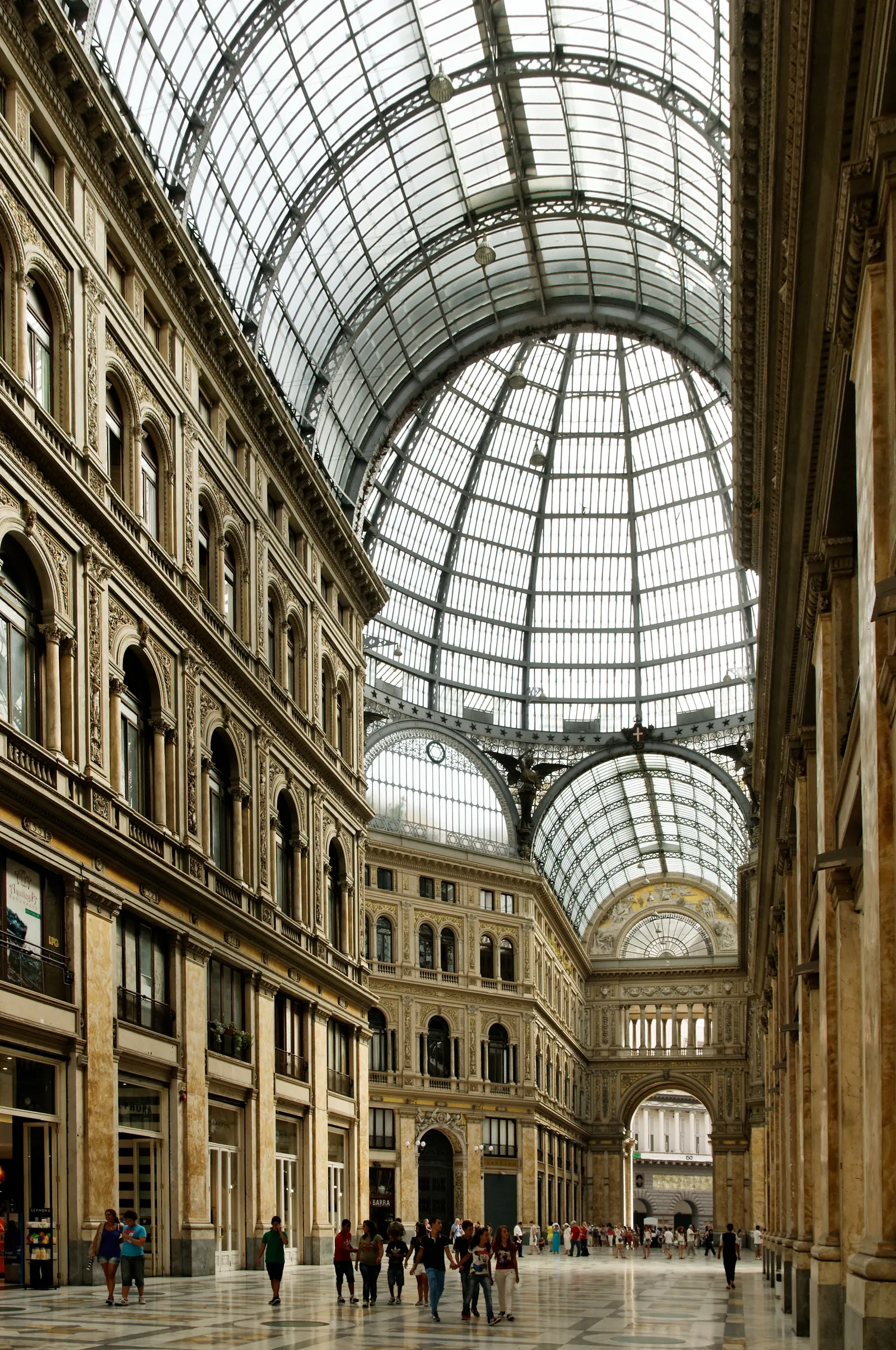 The glass-domed interior of the Galleria Umberto I shopping arcade in Naples