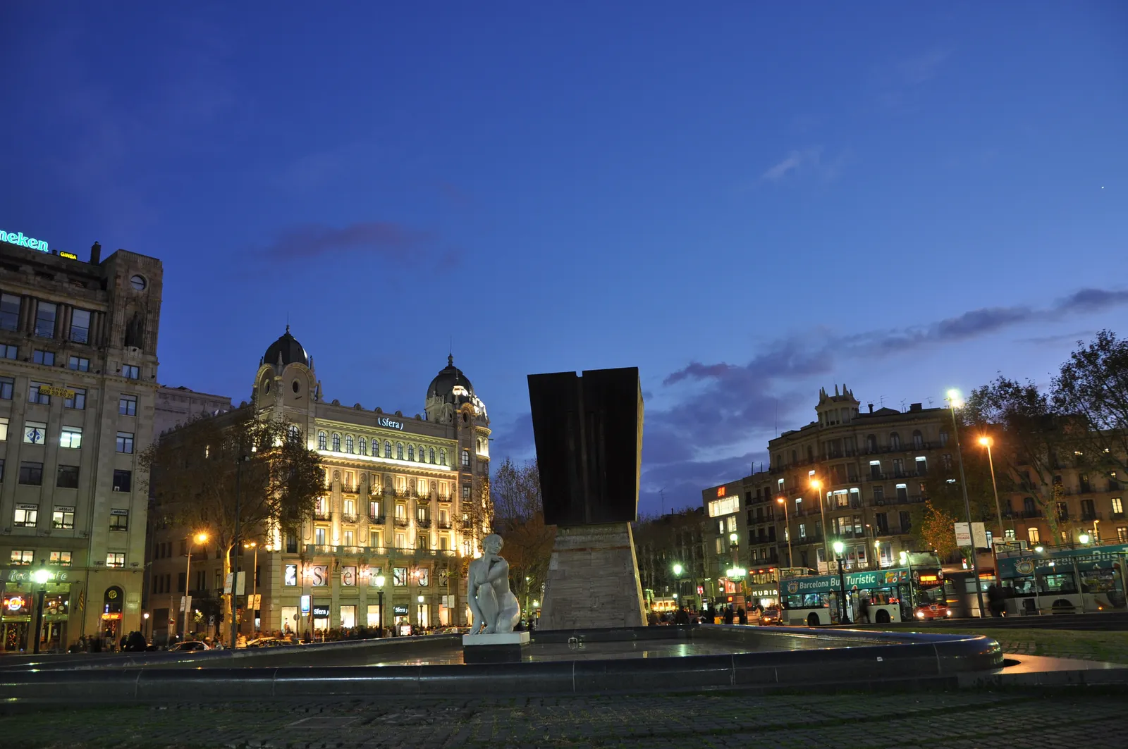 Plaça de Catalunya, Barcelona's central square, with pigeons and pedestrians