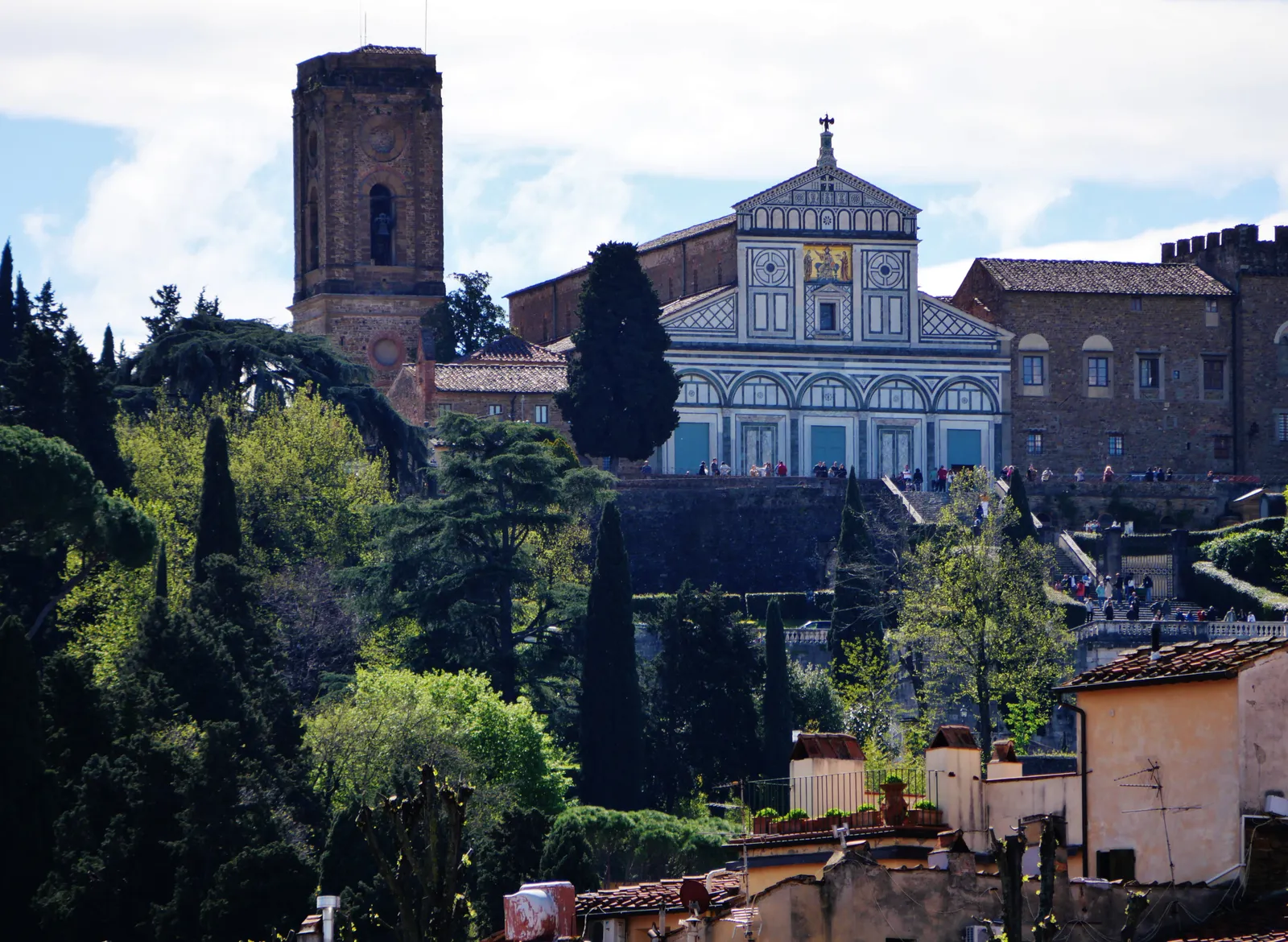 The green and white marble facade of the Basilica of San Miniato al Monte on the hillside above Florence