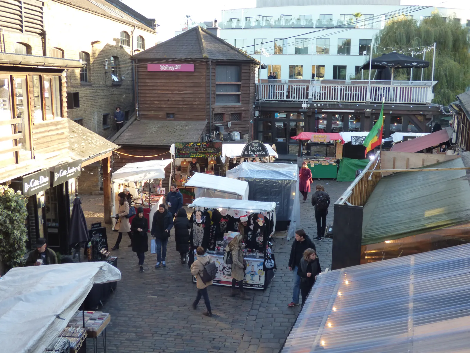 Market stalls in the cobbled courtyard of Camden Lock beside Regent's Canal