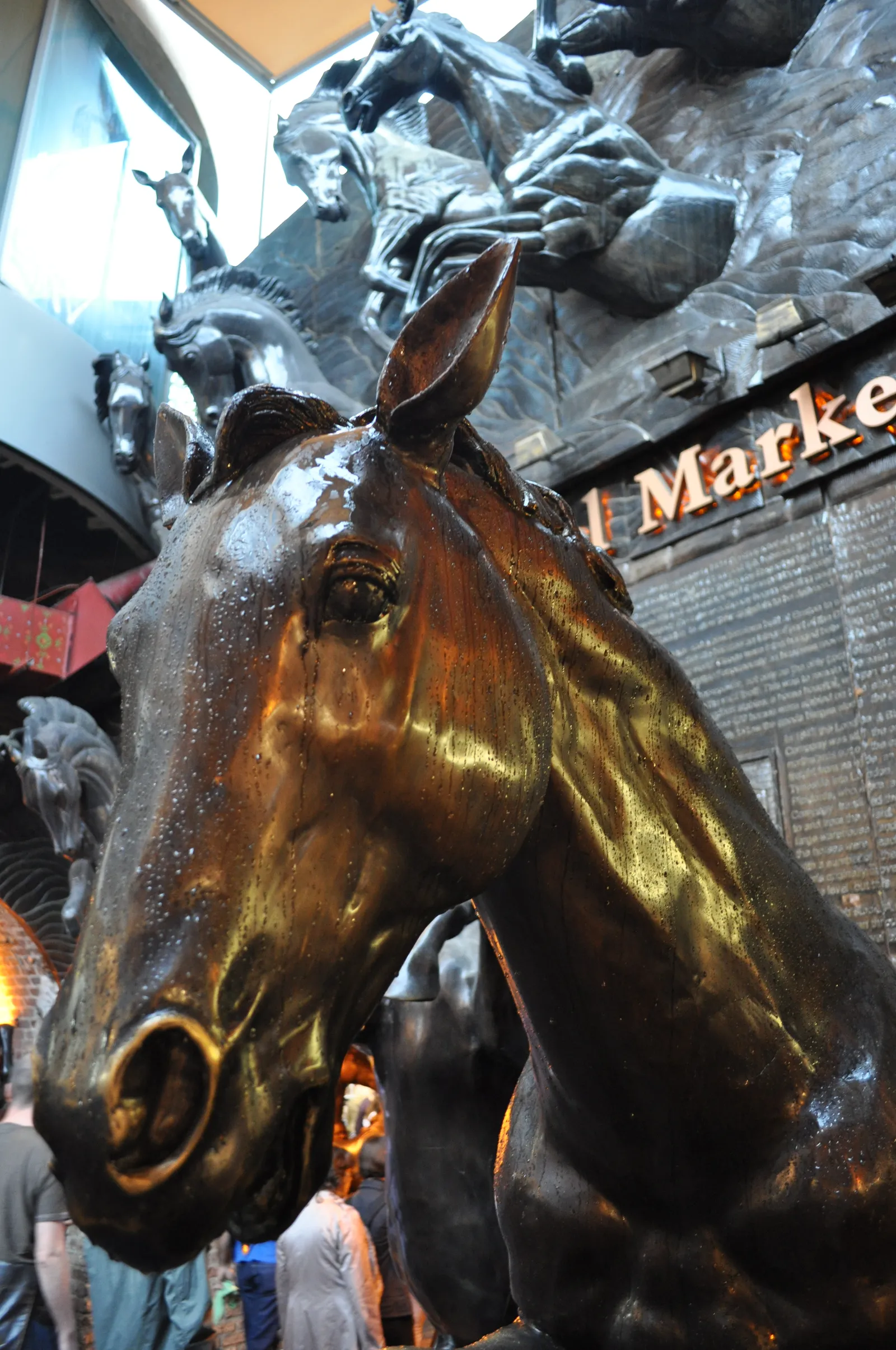 One of the large bronze horse statues marking the entrance to Camden Stables Market