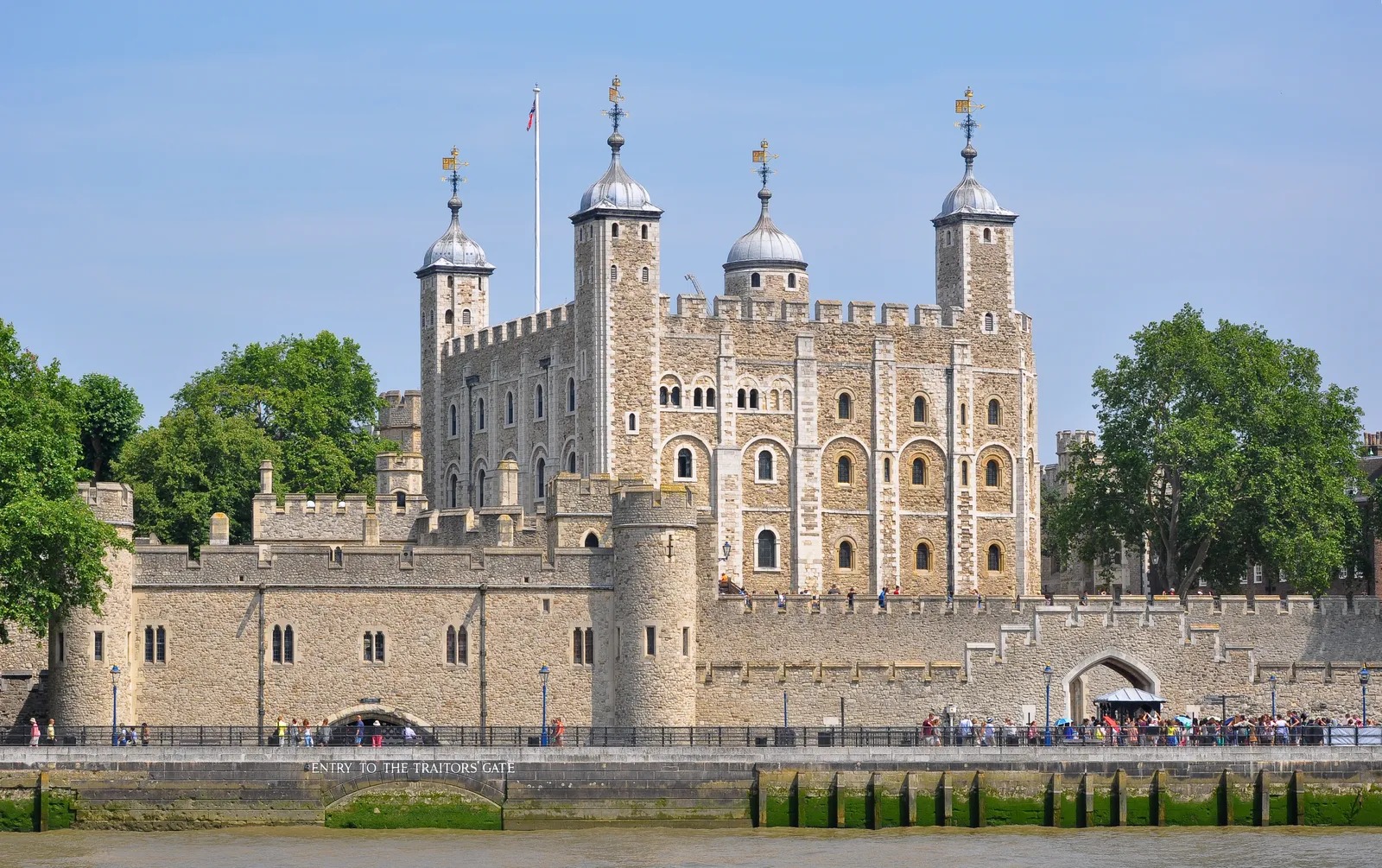 The White Tower and the fortified walls of the Tower of London seen from the River Thames