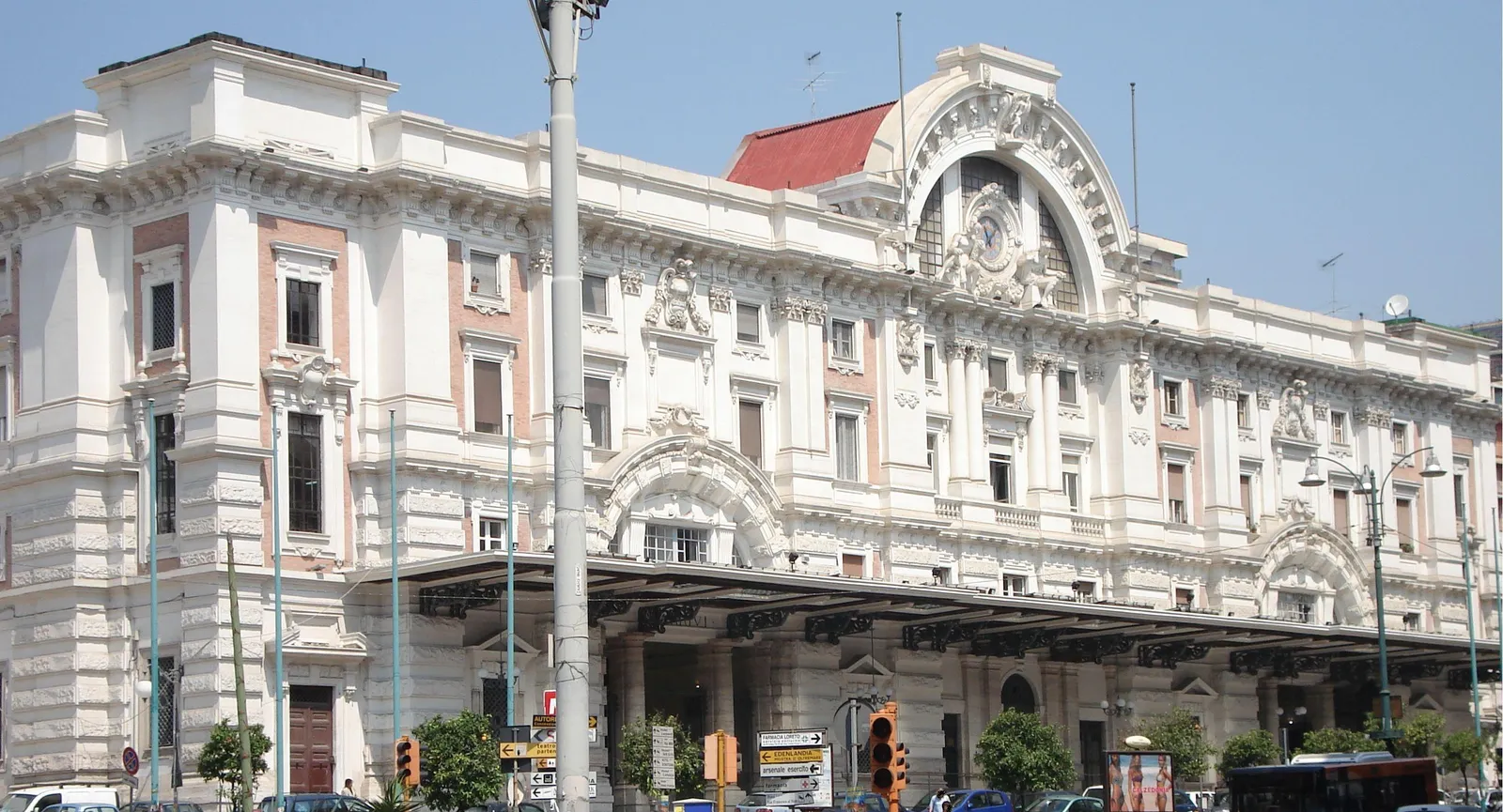 The ornate white stone facade of Mergellina train station in Naples