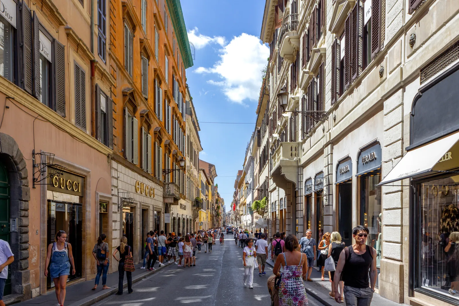 Via dei Condotti in Rome, a narrow shopping street lined with designer boutiques and pedestrians