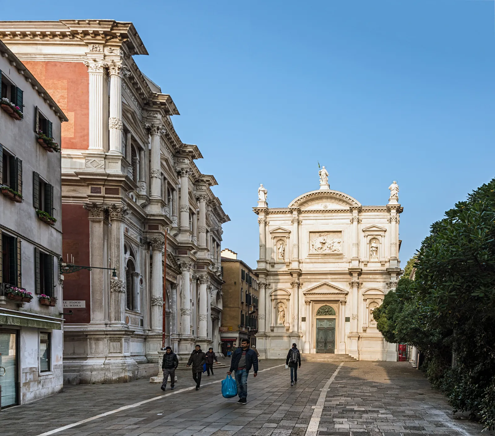 Campo San Rocco in Venice's Santa Croce district, a quiet square lined with marble facades and pedestrians